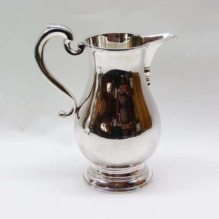 Sterling silver baluster shaped jug by C.J. Vander Ltd